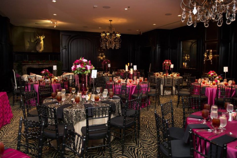 Black lace overlays perfecly complimented the Deja Vu room and added an elegant touch. Rosette Linens for the cake and sign in table. Linens: Aztec Events and Tents