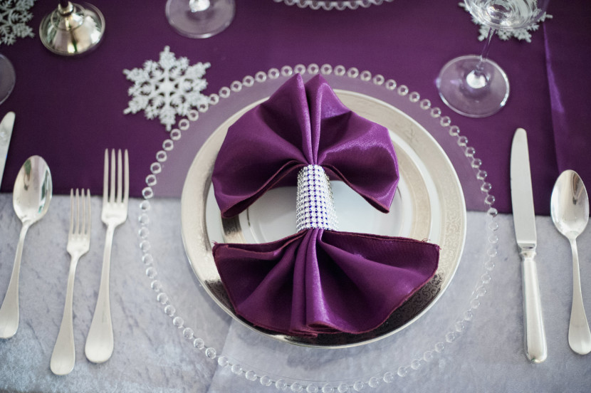 Fan-fared napkins, bling napkin rings and silver rimmed chargers - just a few details that made our table scape complete. All rentals from Aztec Events and Tents.