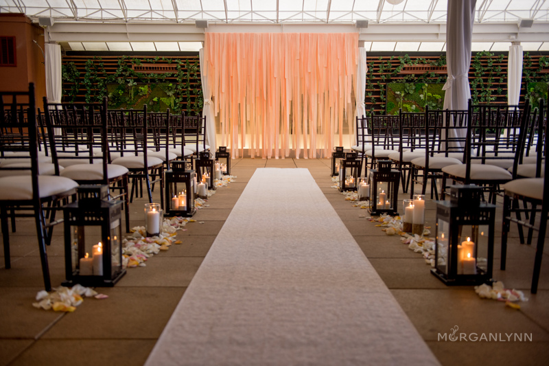 Peach ribbon backdrop handmade by the mother of the groom. Truly gorgeous and completely transformed the room!